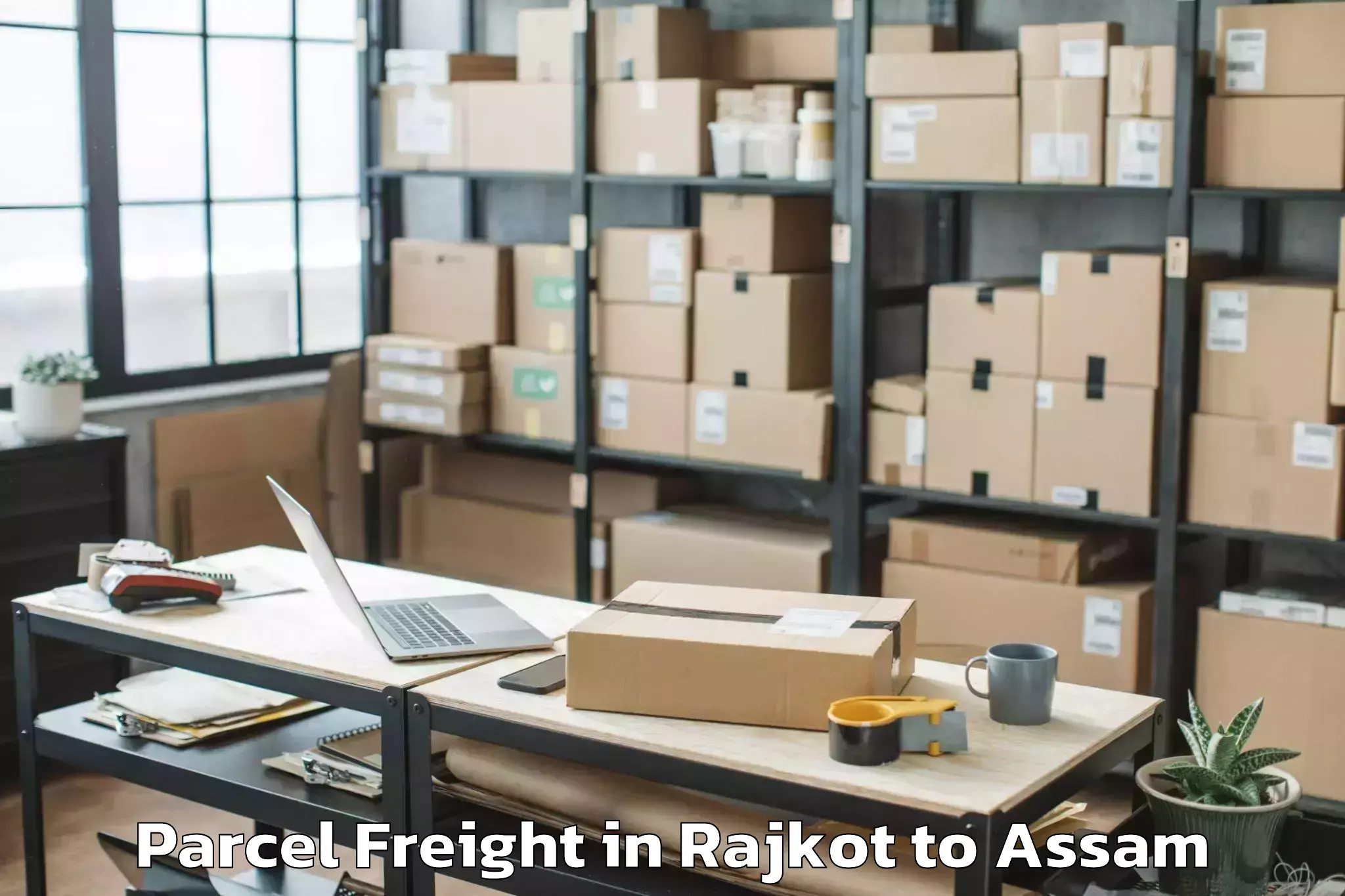 Book Rajkot to Pachim Nalbari Parcel Freight